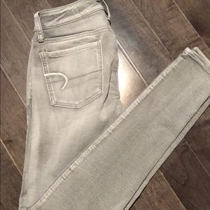 light grey faded style american eagle jeans